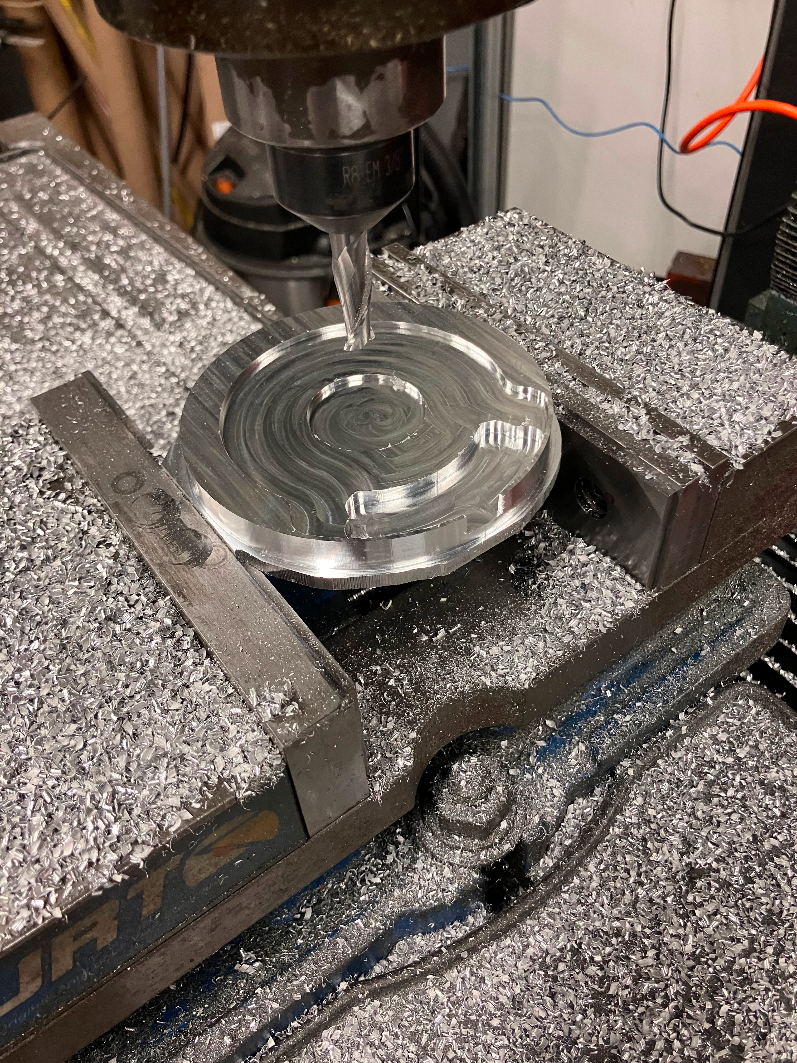 The base component in the mill vise after the CNC job.
