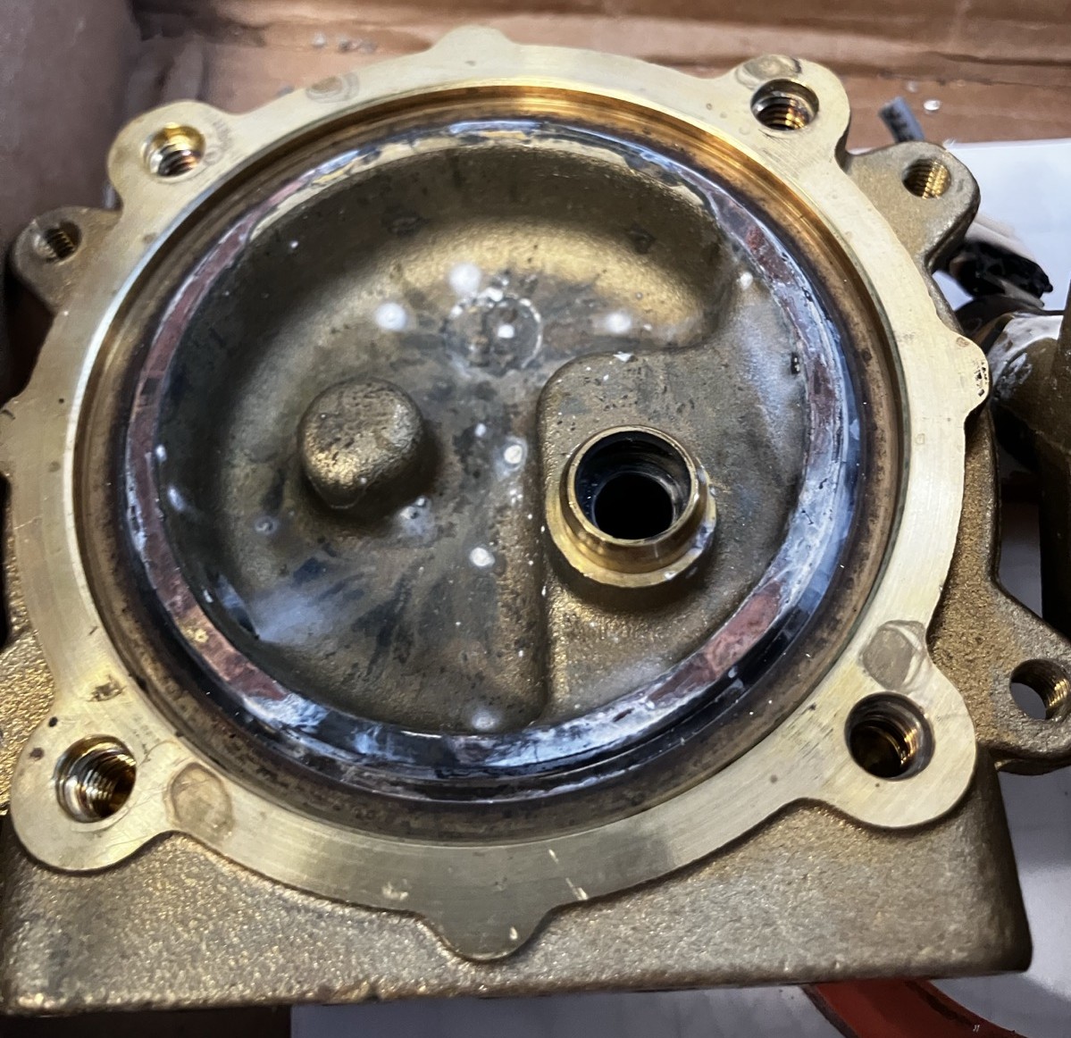 The group head covered in internal corrosion.