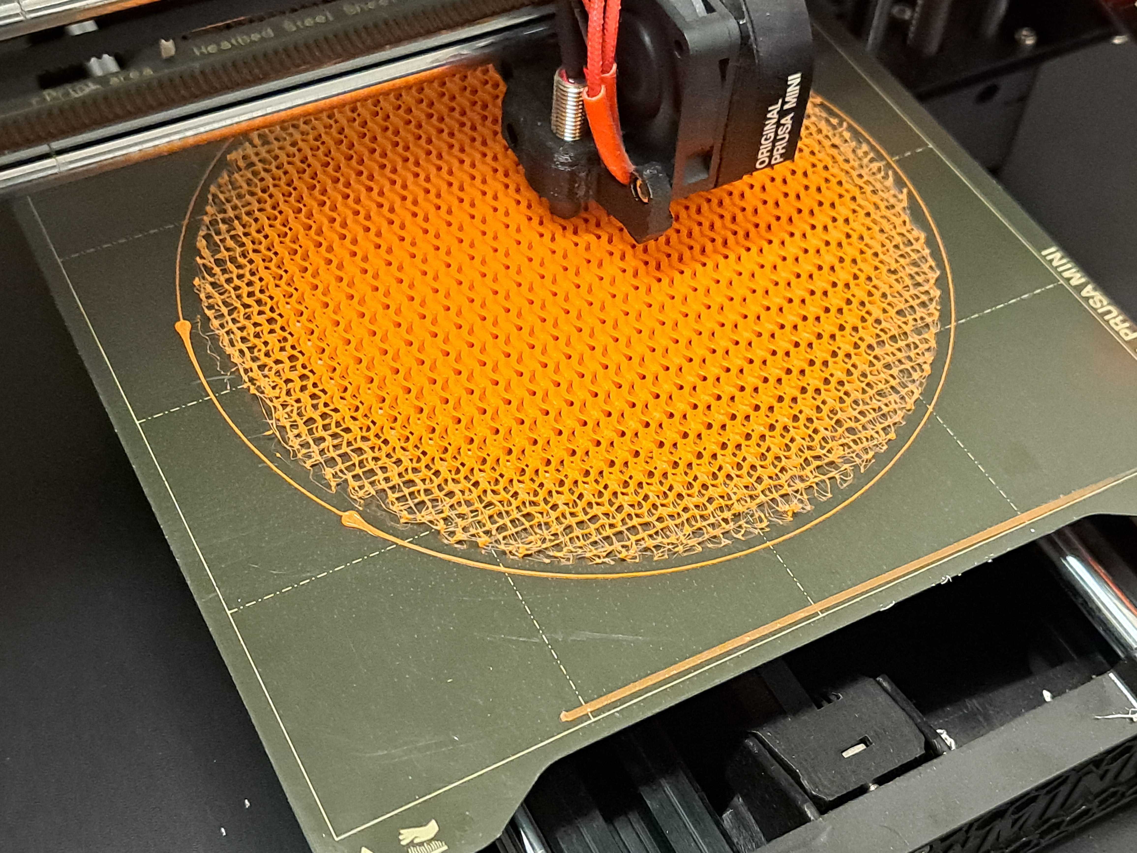 The beginning of the print of the PLA Wood lens