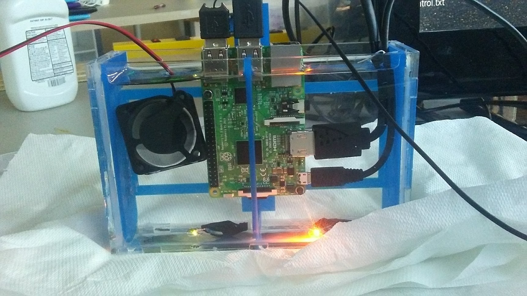 A raspberry pi submerged in mineral oil