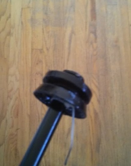 the top of the bike pump plunger