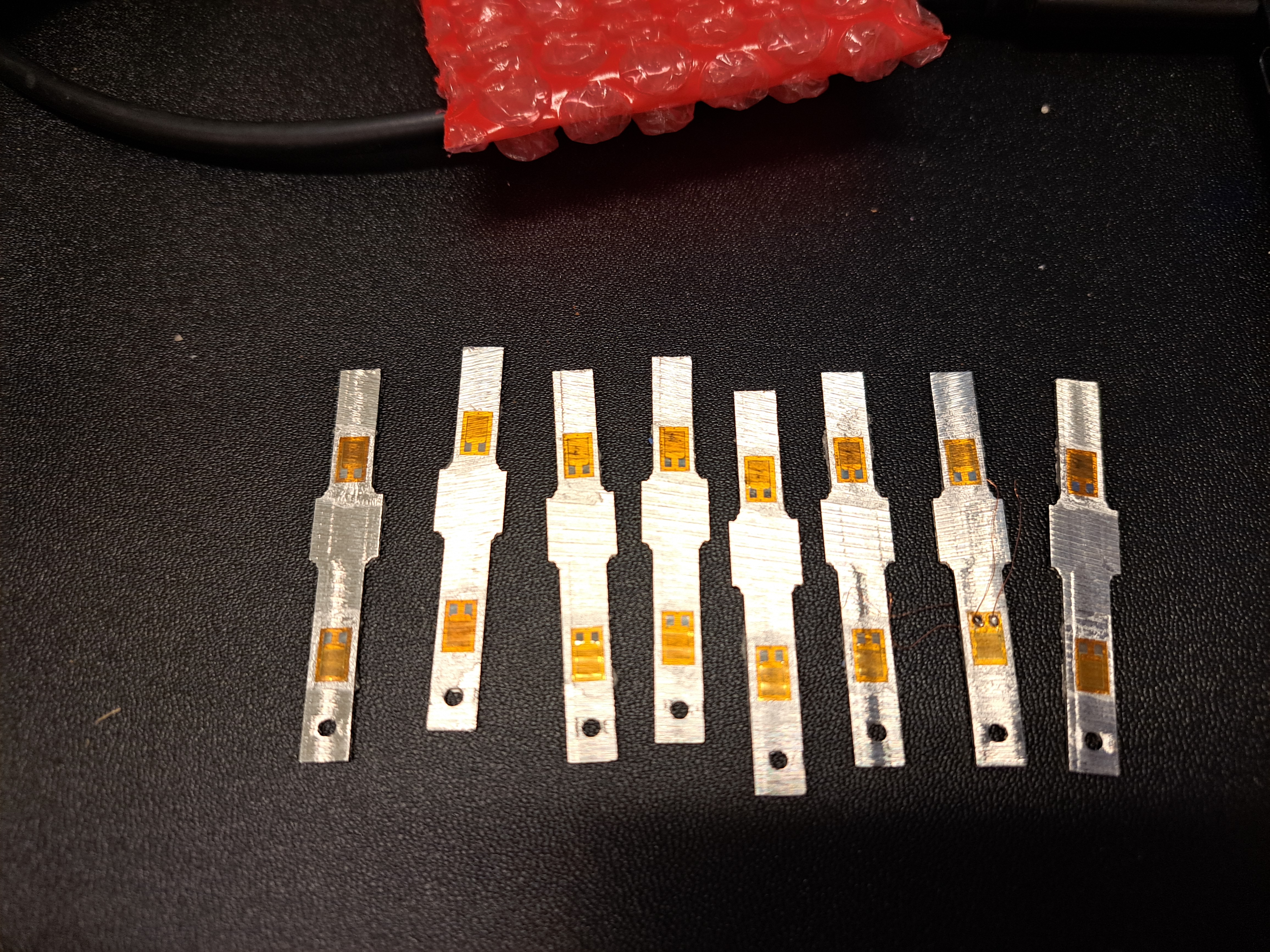 8 load cells with the strain gauges glued on.