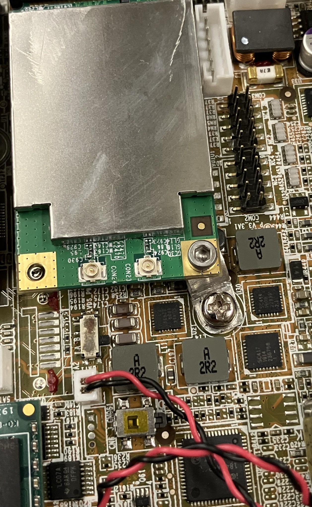 The WiFi card bolted to a custom bracket on the board.